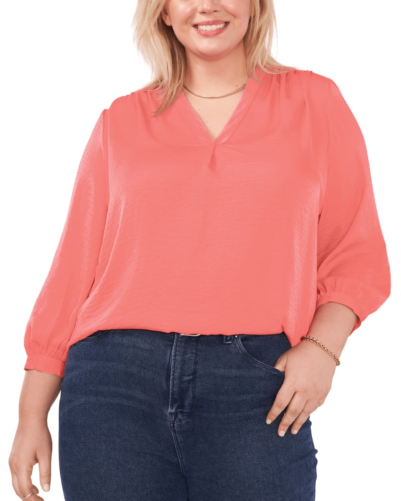 Front of a model wearing a size 1X Everley V-Neck Blouse in LUSH CORAL by Vince Camuto. | dia_product_style_image_id:260852